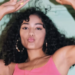 Woman dancing with curls